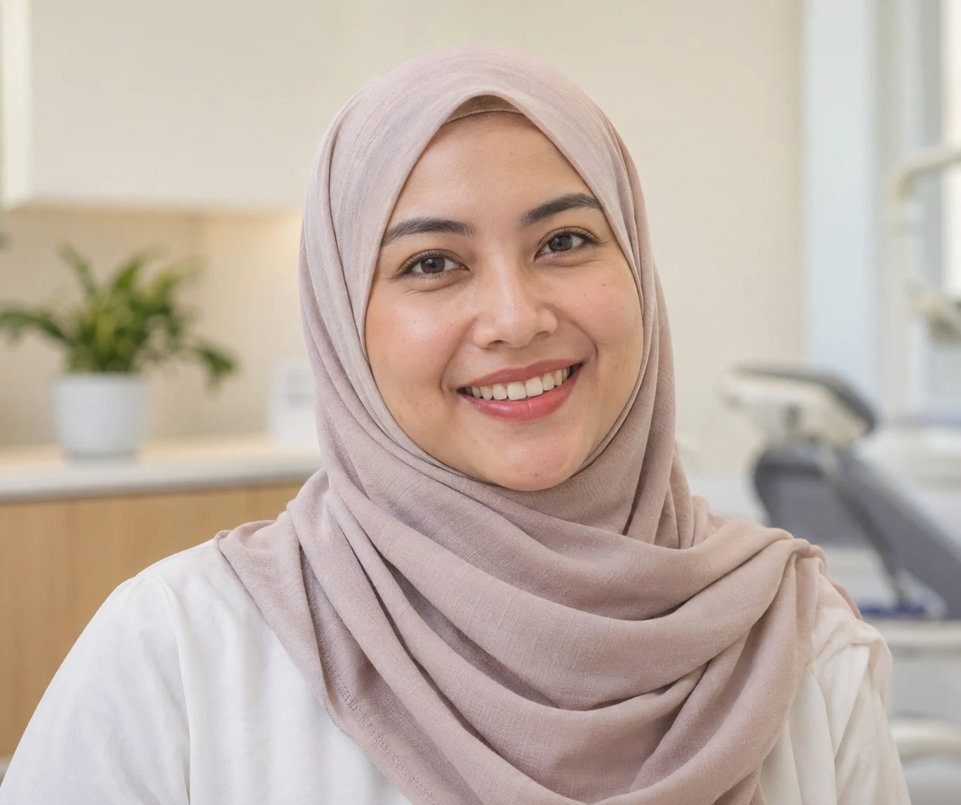 Smiling woman in a hijab at a Dental Suite clinic (illustrative photo).