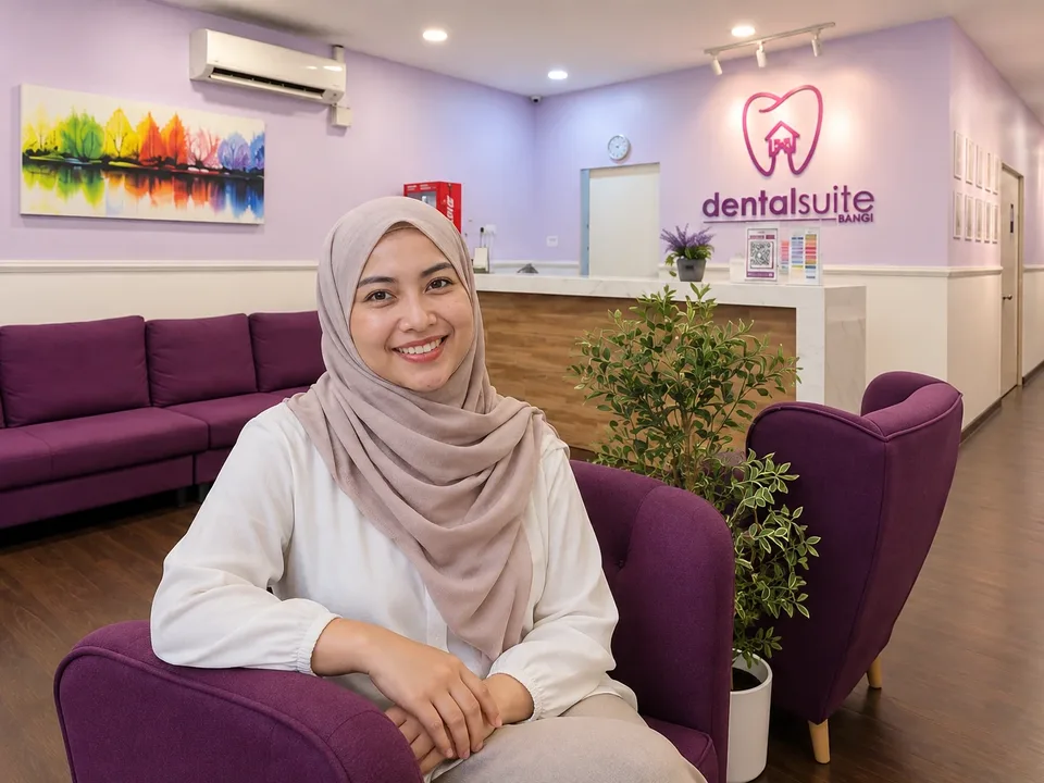 Smiling woman in a hijab seated in a Dental Suite clinic lounge (illustrative photo).